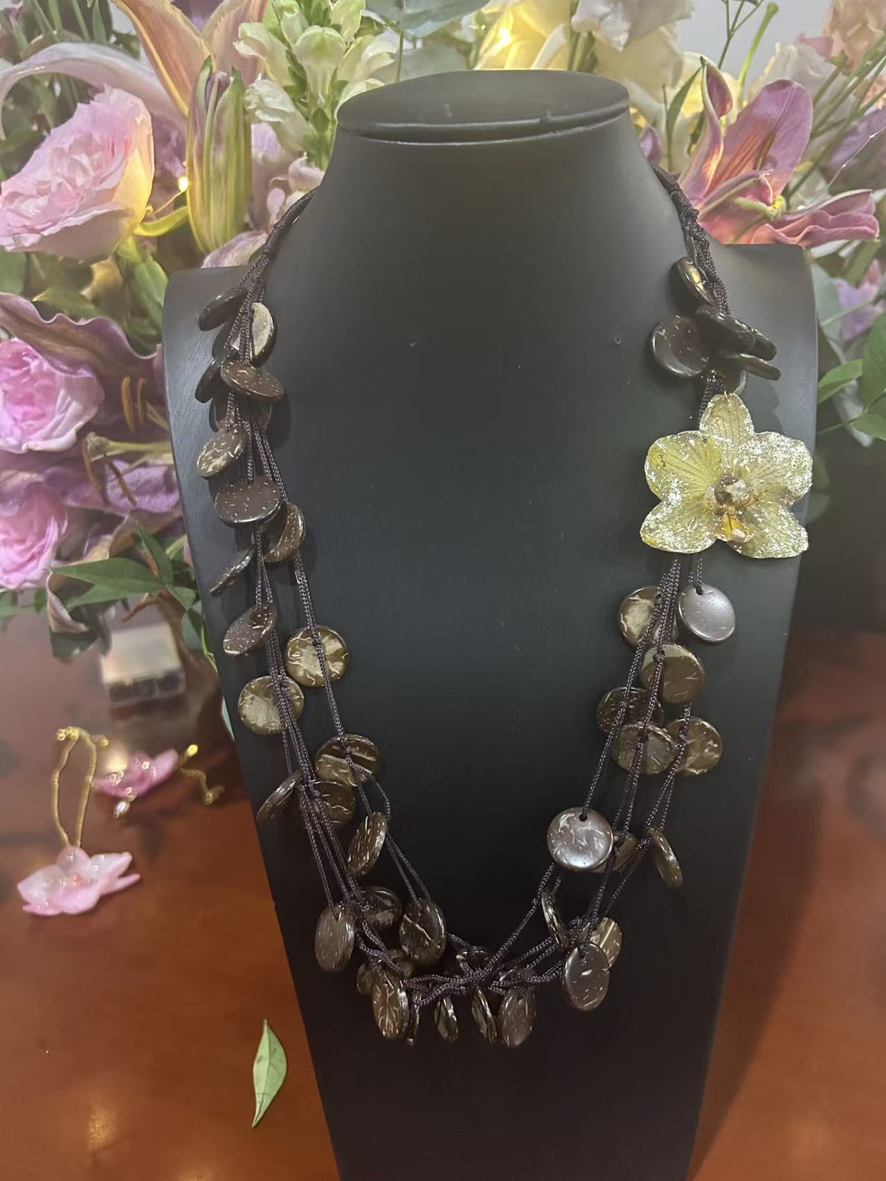 Black statement necklace with preserved flower
