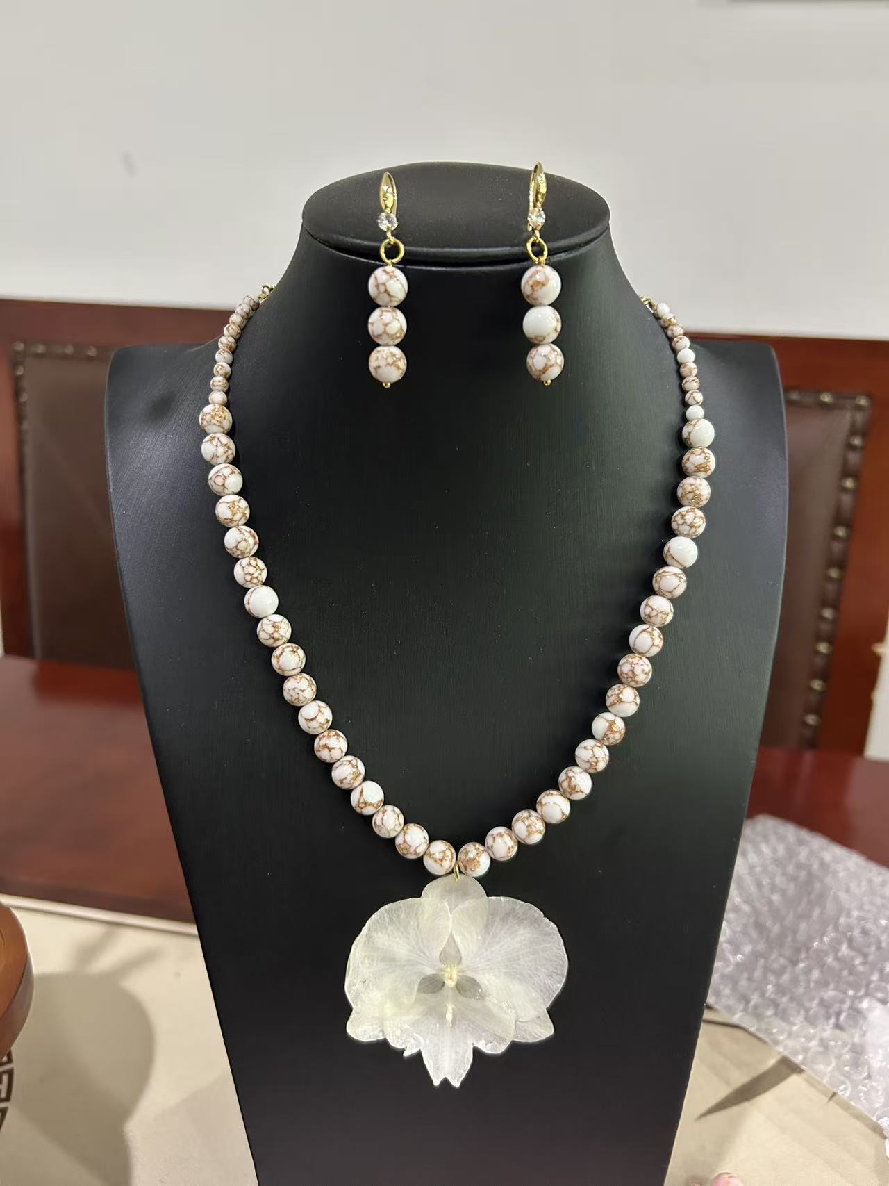 Ivory orchid necklace and earrings