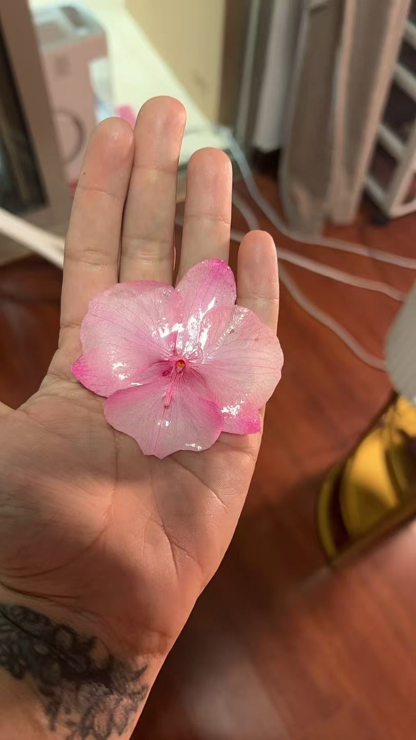 Pink preserved flower before assembly